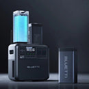 BLUETTI power station and battery pack on a dark background